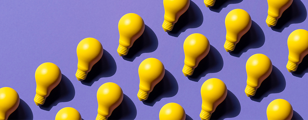 Yellow lightbulbs on a purple background