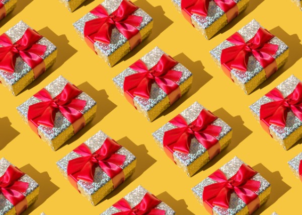 silver-wrapped gift boxes tied with a bright red bow