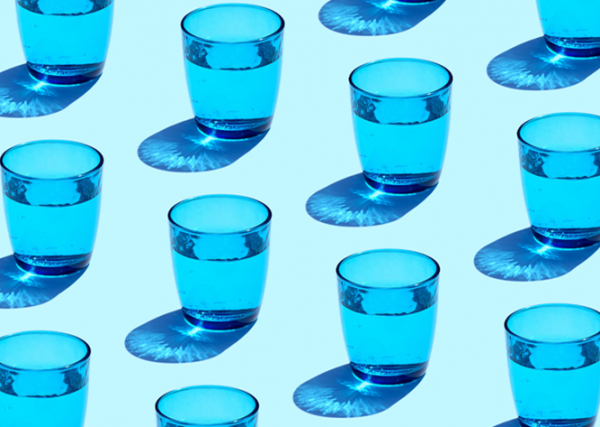 blue drinking glasses filled with water
