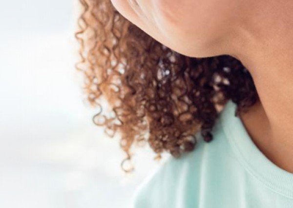 image of a woman scratching a rash on her neck