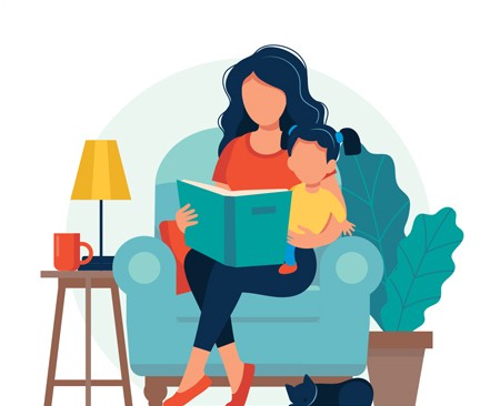 A child sits on a woman's lap while they read a book together